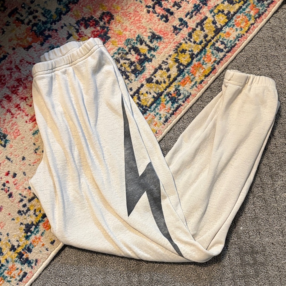 Aviator Nation Cream Track Pants with Black Lightning Bolt